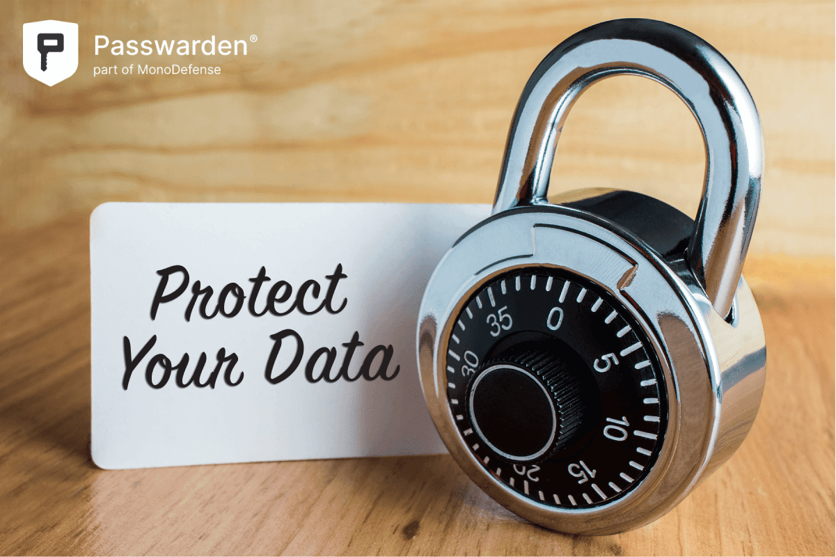 Protect Your Data on a white paper next to padlock with wooden background, conveying concepts of data security